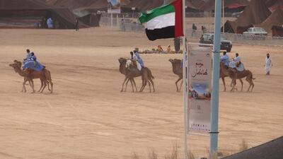 People ride camels at the Tan-Tan Moussem Festival in Morocco. Courtesy TCA