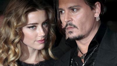 Cast member Johnny Depp and his actress wife Amber Heard arrive for the British premiere of the film "Black Mass" in London, Britain October 11, 2015. REUTERS/Suzanne Plunkett/File Photo