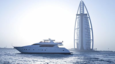 A yacht sails around the Burj Al Arab. Courtesy Xclusive Yachts