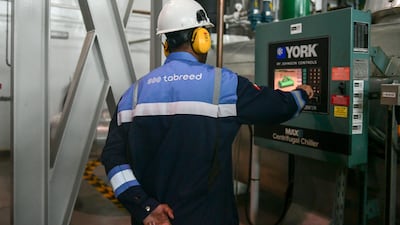 Staff on a control panel at the plant