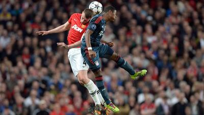 Bayern Munich midfielder David Alaba, right, and Manchester United defender Phil Jones, left, vie for the ball during their sides' 1-1 draw in the Champions League on Tuesday night. Christof Stache / AFP / April 1, 2014