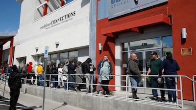 People wait in line for help with unemployment benefits in Las Vegas. The number of Americans filing for unemployment has soared to nearly 39 million in nine weeks. AP