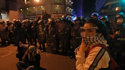 Lebanese students protest a decision by top universities to adopt a new dollar exchange rate to price tuition in Beirut's Hamra district. AFP