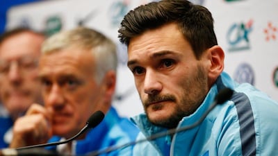 Didier Deschamps the head coach of France and Hugo Lloris the captain of France address the media. Clive Rose / Getty Images