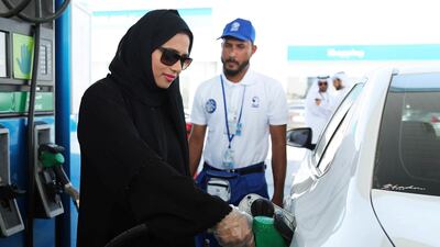 An Emirati woman uses self service at an Adnoc service station. Courtesy: Adnoc Distribution