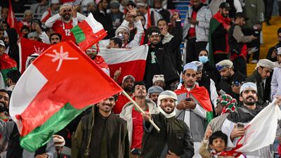 Oman's fans cheer their team at the Jaber Al Ahmad Stadium. AFP