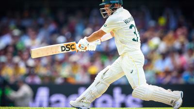 Australia's David Warner plays a reverse sweep. AFP