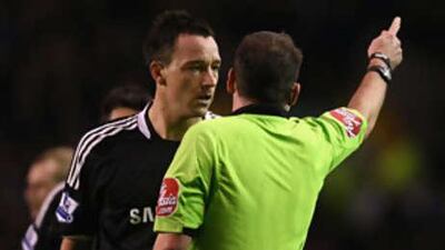 The Chelsea captain John Terry is given his marching orders by the referee Phil Dowd after a debatable challenge on Everton's Leon Osman.