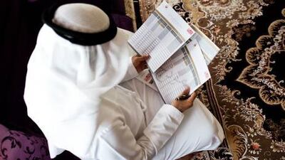 Adeeb Al Hammadi, 26, fills out the Abu Dhabi Census in his Khalidiya apartment. The census will request details such as name, occupation, age, marital status, education and nationality from every Abu Dhabi resident over the coming three weeks.