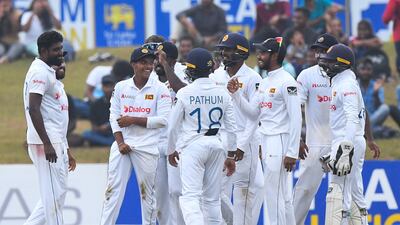 Sri Lanka's Dunith Wellalage, second left, celebrates with teammates after catching out Pakistan opener Abdullah Shafique for 16. AFP