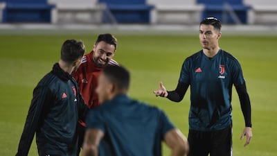 Ronaldo (R) speaks to teammates during a training session in Riyadh. AFP
