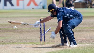 Scotland's Mark Watt has his leg stump uprooted by UAE pace bowler Zahoor Khan.