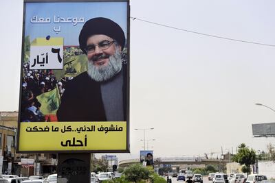 A portrait of Lebanese Hezbollah movement leader Hassan Nasrallah is fixed on the side of a road in the mainly Shiite Muslim southern suburbs of Beirut on May 4, 2018, ahead of the weekend's legislative elections. Joseph Eid / AFP Photo