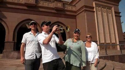 Trumpter Bill Cooper is confident England cricket team will bounce back in the Abu Dhabi Test match with the help of some musical support. Above, Bill with Ian Bailey, Sara Thornton-Bryar and Chris Crabb. Delores Johnson / The National