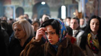 Worshippers attend a service of the Nativity of Christ Liturgy at the Serbian Orthodox Church of the Holy Prince Lazar in Birmingham, central England. AFP