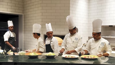 Staff preparing food at the new Marco’s New York Italian restaurant, which opened in Abu Dhabi this week. The National