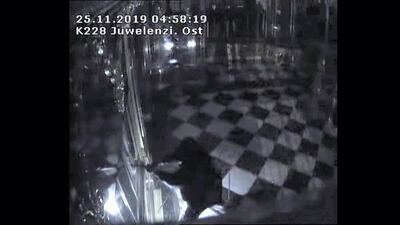 CCTV captures burglars with torches breaking into a display cabinet at the Green Vault museum in Dresden, Germany, in November 2019. Saxony Police Department/Handout via Reuters