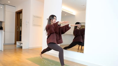 She teaches Pilates at her home in City Walk