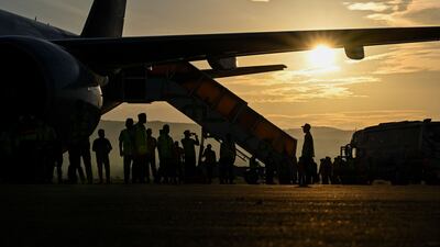 Pilgrims board a passenger plane heading to Mecca. AFP