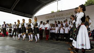 Traditional Serbian dancers perform during the event.
