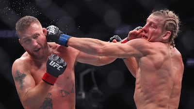 Justin Gaethje, left, and Paddy Pimblett exchange blows in their interim lightweight title bout at UFC 324. AFP