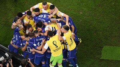 Argentina's Alexis Mac Allister celebrates with teammates after scoring. Getty