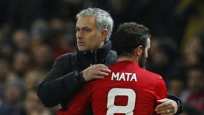 Juan Mata, right, scored the first of Manchester United's two goals against Hull City as Jose Mourinho looks to become only the third manager after Brian Clough and Alex Ferguson to win a fourth. League Cup Phil Noble / Reuters