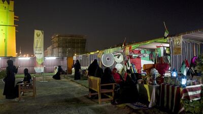 Women sell dry furits, food and perfumes at heritage festival.
