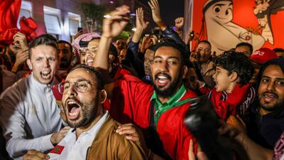 Morocco fans celebrate at Souq Waqif in Doha after their country's World Cup win over Portugal. AFP