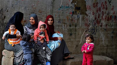 Women and children in the Ouzai refugee compound, in the southern port city of Sidon, Lebanon. Bilal Hussein / AP