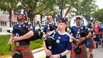 Scotland fans play bagpipes as Scotland's Tartan Army travel to Miami Stadium for the match between Scotland and Brazil. Reuters