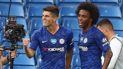 Chelsea's Christian Pulisic, left, celebrates scoring the opening goal in his team's 2-1 win over Manchester City in the Premier League clash at Stamford Bridge, on Thursday, June 26. AFP