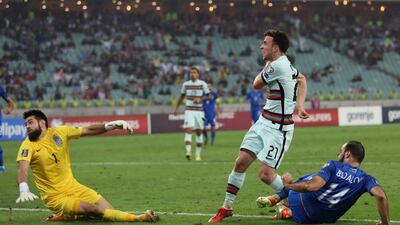 Portugal's Diogo Jota, second right, scores. AP