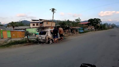 A burnt car on the street in Manipur, north-east India. Photo: Instagram @the_mj_rider / Reuters