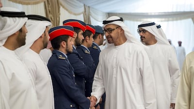 Sheikh Mohammed bin Zayed, Crown Prince of Abu Dhabi and Deputy Supreme Commander of the Armed Forces, offers condolences to the family of martyr Zayed Al Kaabi who died while serving with the Armed Forces in ‘Operation Restoring Hope’. He is seen with Major General Sheikh Khaled bin Mohammed bin Zayed, Chairman of the State Security Department, back left. Rashed Al Mansoori / Crown Prince Court - Abu Dhabi