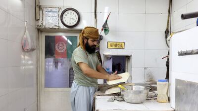 Bakers from Afghanistan make bread in Al Satwa, Dubai. Chris Whiteoak / The National