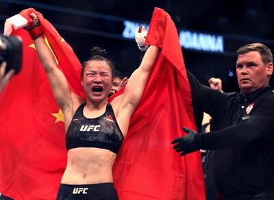 Zhang Weili celebrates her win by decision over Joanna Jedrzejczyk. AP Photo