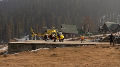 Affluent tourists take $160 helicopter rides in Gulmarg, Kashmir, as there is no snow for traditional winter sports. Wasim Nabi for The National