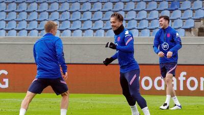 England's James Ward-Prowse, left, Jack Grealish and Michael Keane during training. Reuters