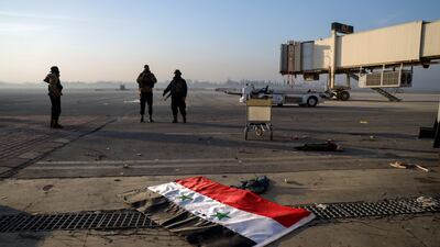 Syrian opposition fighters at the Hama military airport. AP