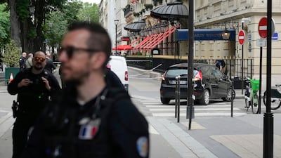 Police officers guard the Harry Winston jewellery shop in Paris, after a robbery. AP