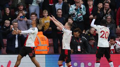 Southampton's James Ward-Prowse celebrates with teammates after levelling at 3-3 against Tottenham. AFP