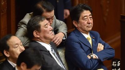 Japan's PM Shinzo Abe and members of his cabinet attend a lower house plenary session about controversial security bills at the parliament in Tokyo on July 16. AFP