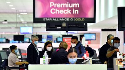 Passengers check in for New Zealand flights at Sydney International Airport. AFP