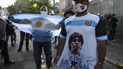Supporters of Diego Maradona gather outside the hospital where underwent brain surgery for a blood clot. AFP