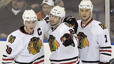 Chicago's Troy Brouwer, centre, scored in overtime.