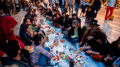 People break their fast in a street of Kadikoy district in Istanbul. AFP
