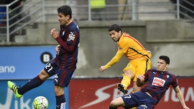 Luis Suarez, centre, in action against Ander Capa, right, and Saul Berjon. Alvaro Barrientos / AP Photo