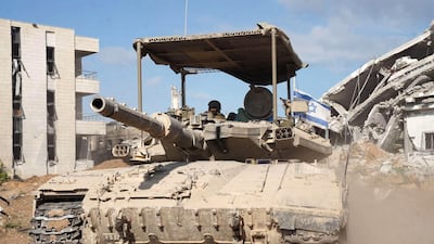 An Israeli main battle tank during operations to destroy a tunnel in central Gaza. An in-depth report has highlighted new issues over tactics of fighting a 'devastated terrain warfare'. AFP