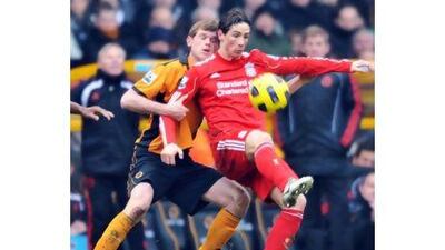 Fernando Torres, right, has scored three goals in his last three league games for Liverpool. Tim Parker / EPA
